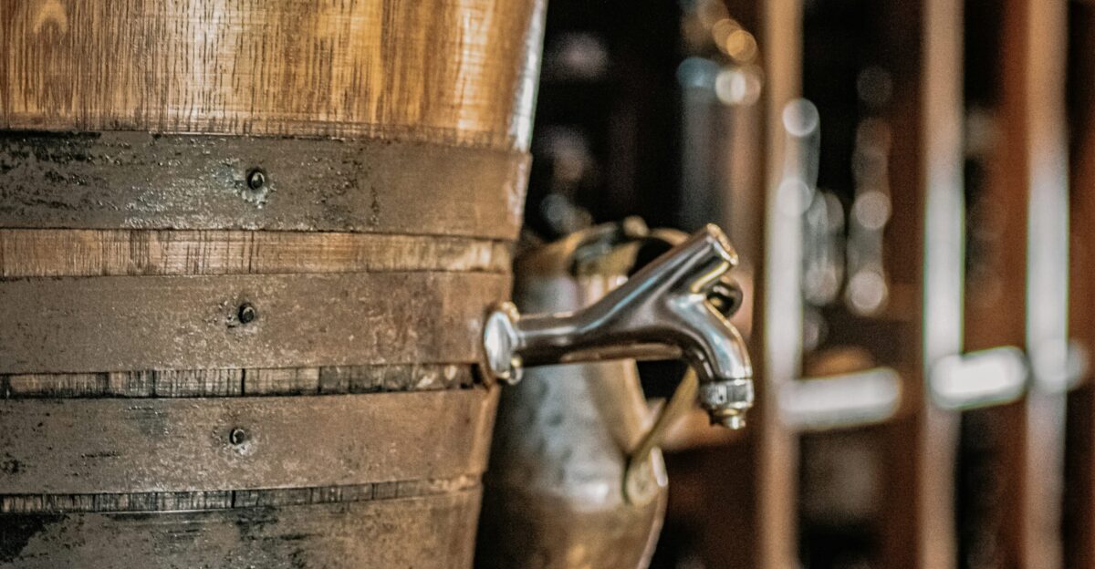 brown wooden barrel with stainless steel faucet