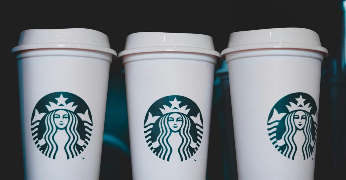 two white starbucks disposable cups