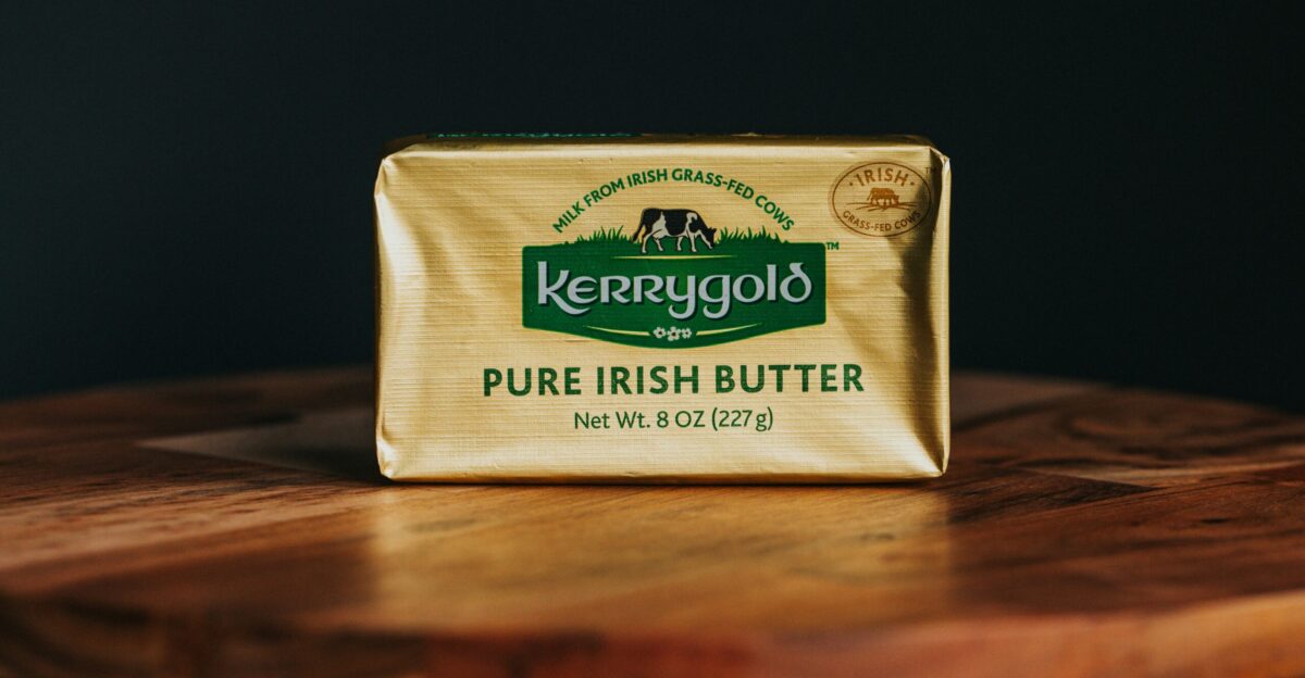 a bar of butter sitting on top of a wooden table