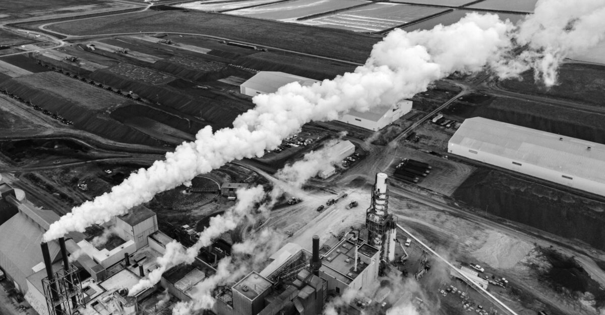 grayscale photo of clouds over city