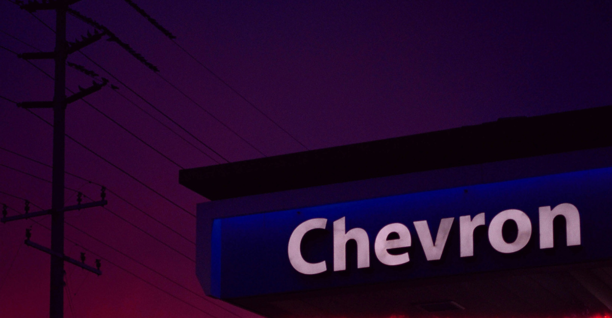 a chevron gas station sign at night