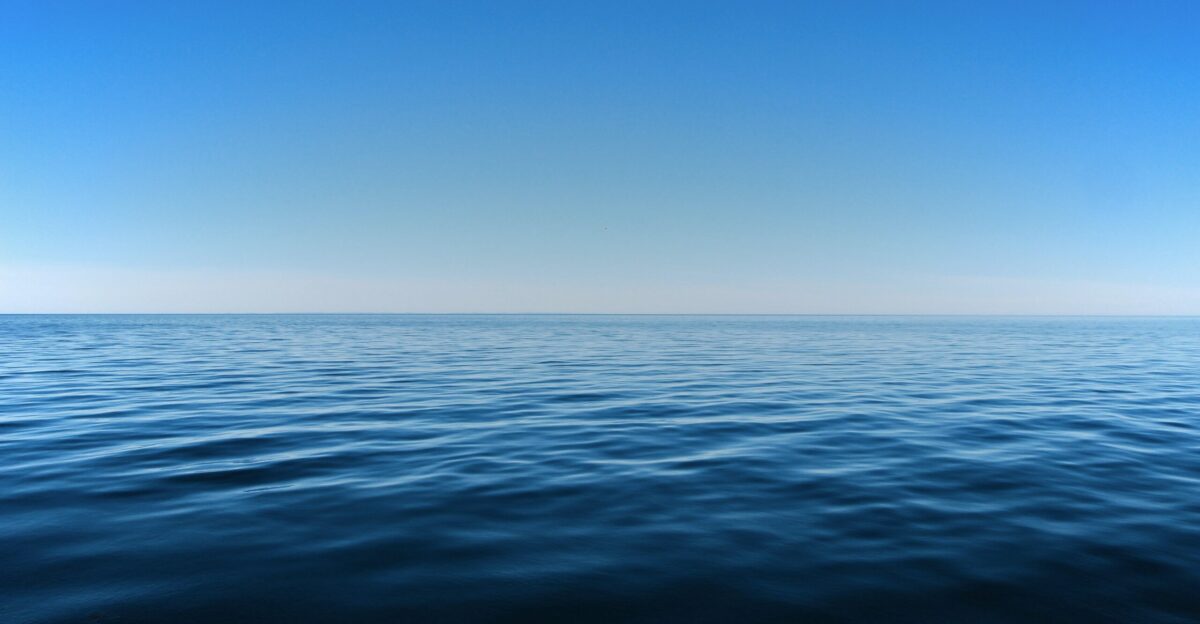 blue ocean water under blue sky during daytime