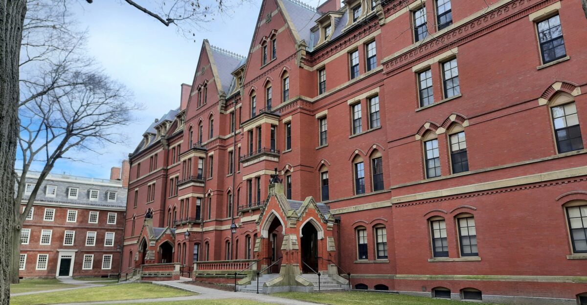 brown concrete building near green grass field during daytime