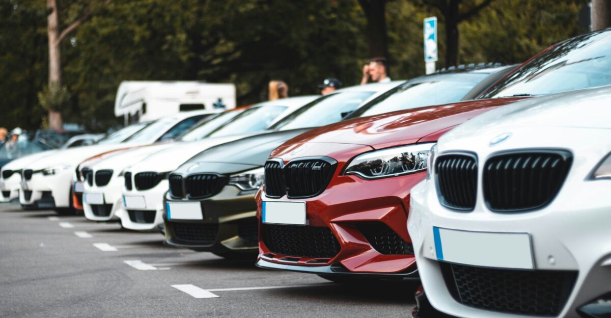 white and red bmw m 3 on road during daytime