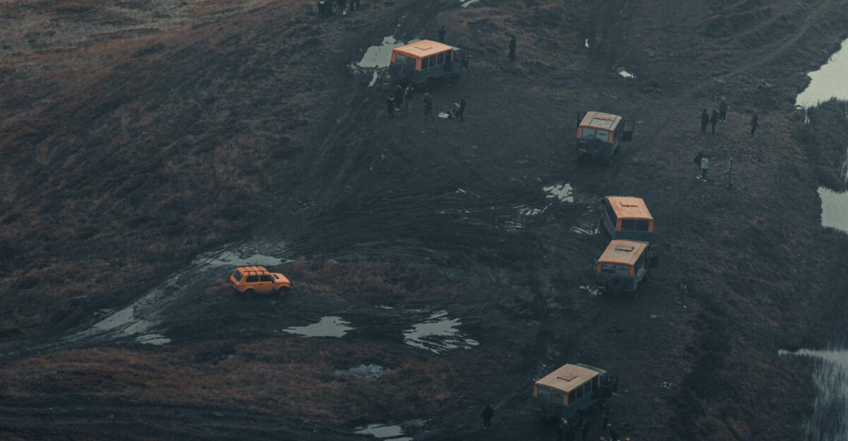 a group of people standing on top of a hill