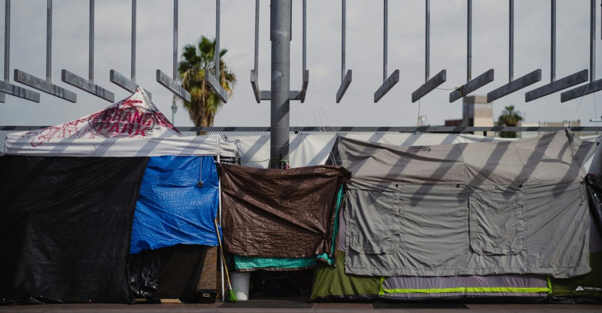 a group of tents sitting on top of a sidewalk