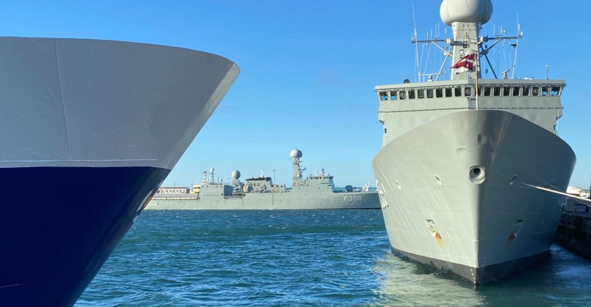 two large ships in the water next to each other
