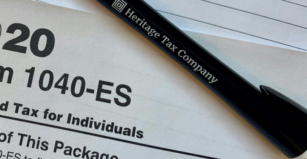 a pen sitting on top of a tax form