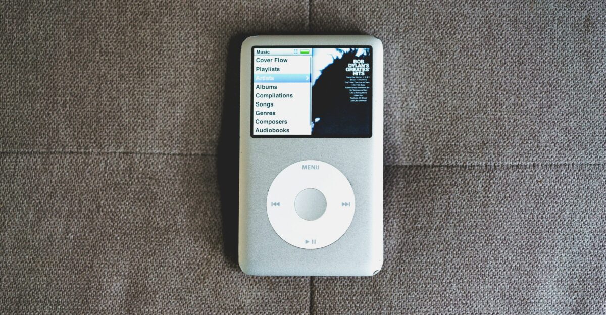 an ipod sitting on top of a couch