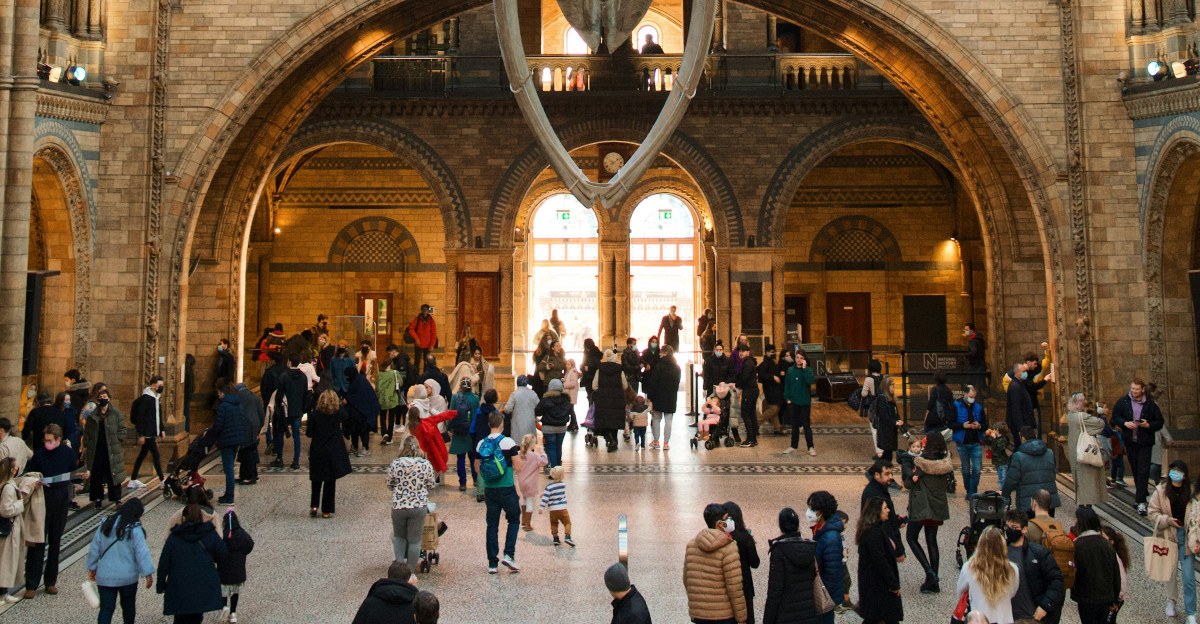 a group of people standing inside of a building