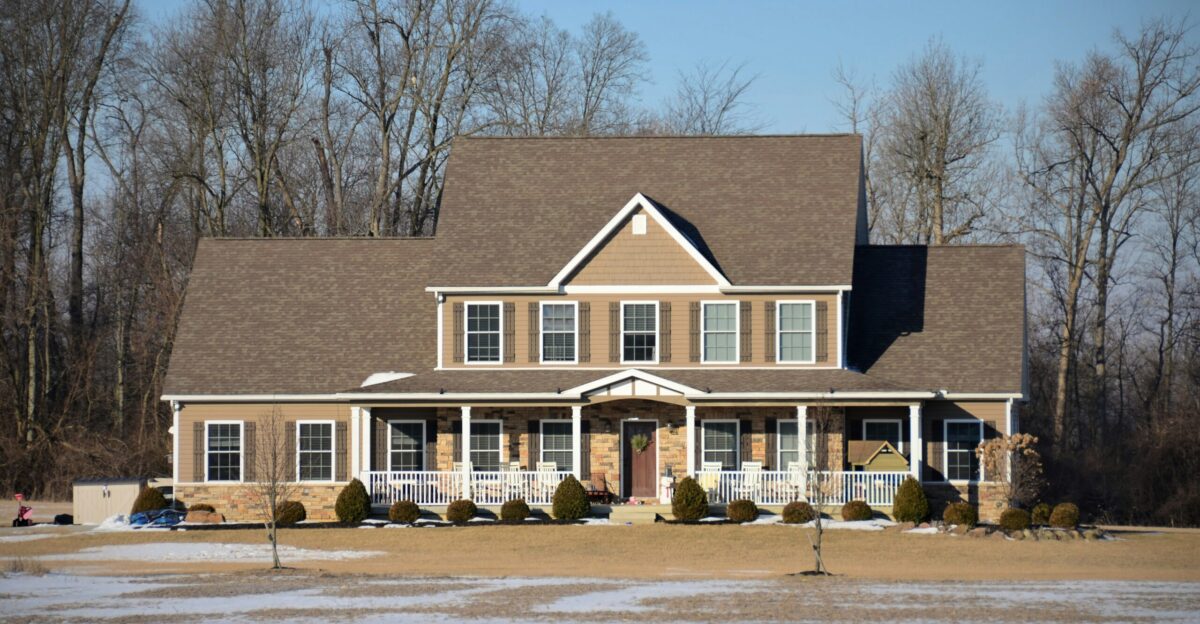a large house with a lot of snow on the ground