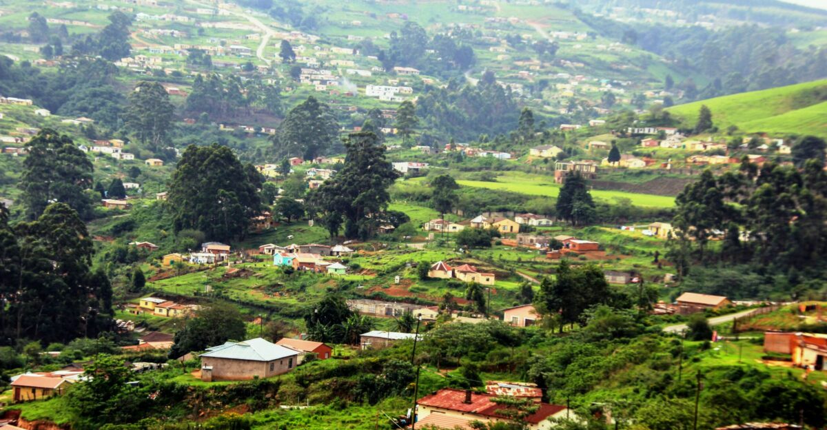 a small village nestled on a green hillside
