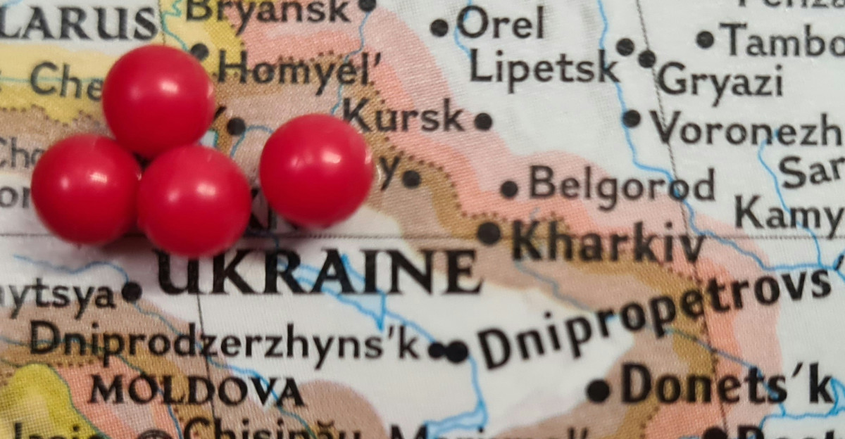 a map with a bunch of red balls on it