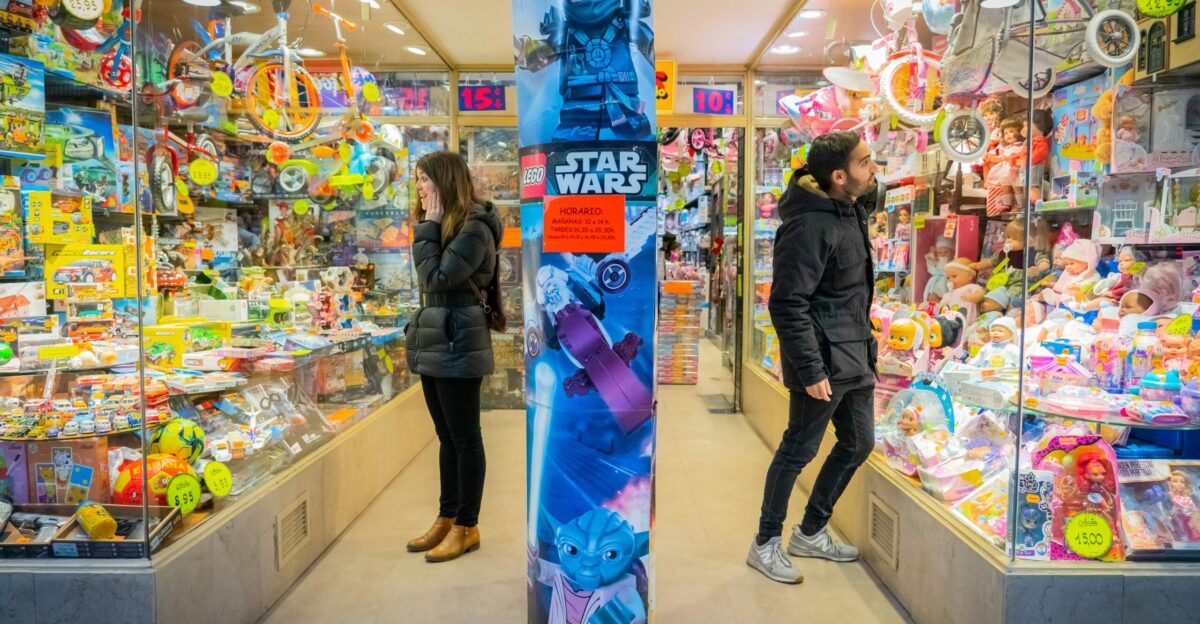 a couple of people that are standing in a store