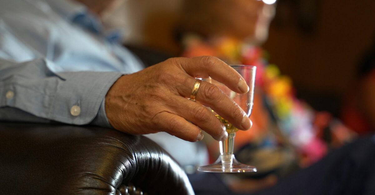 a man holding a wine glass in his hand