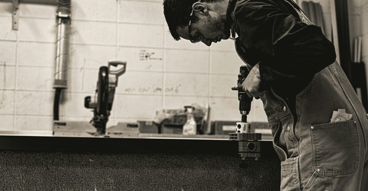a man working on a piece of wood