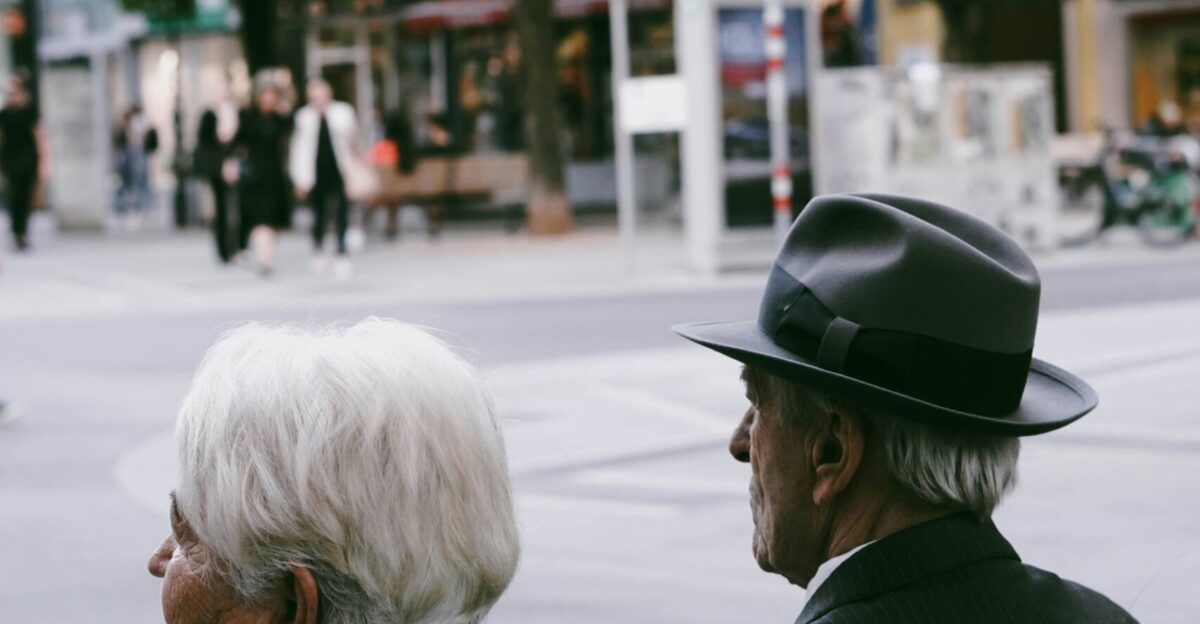 a couple of men sitting on a bench