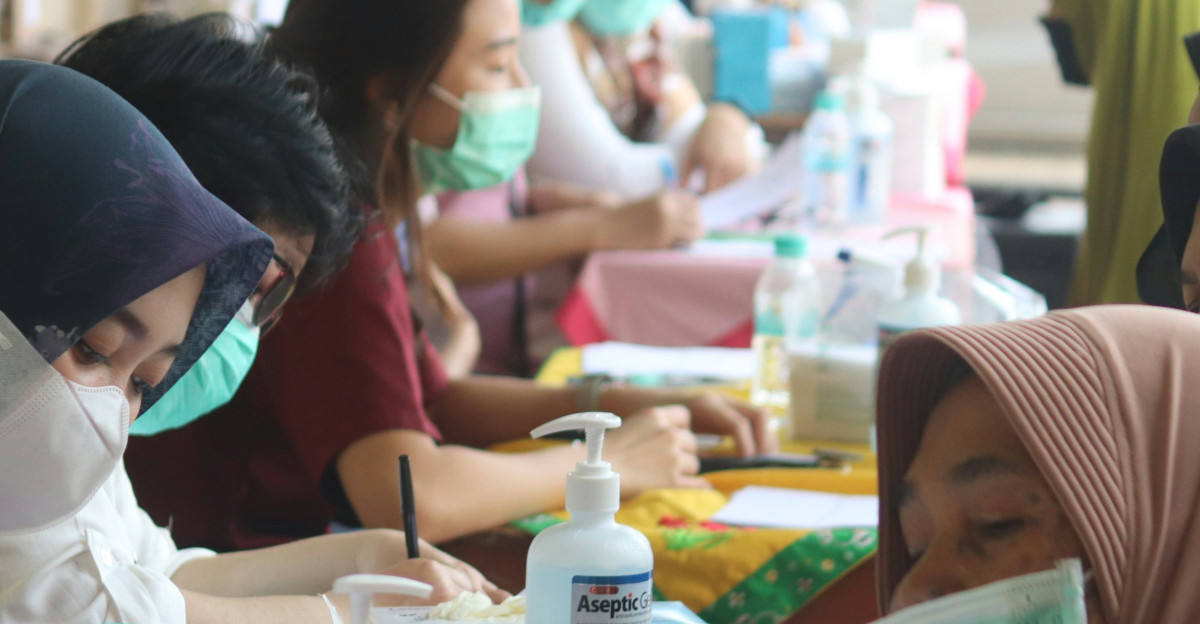 a group of people wearing masks