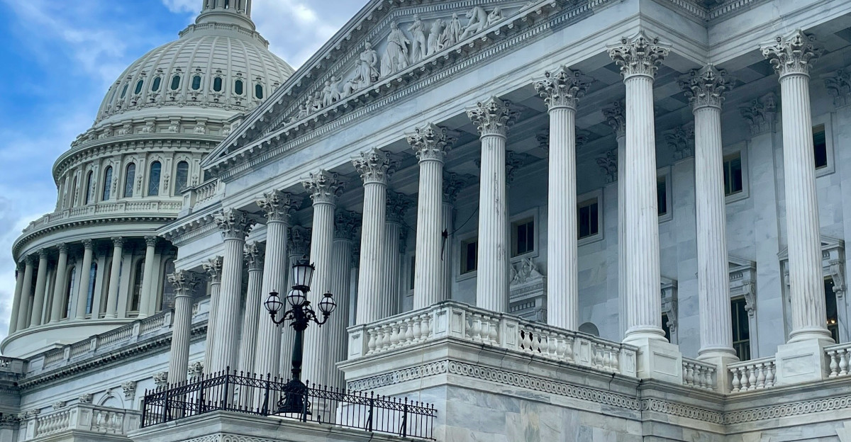 a large white building with a lot of columns