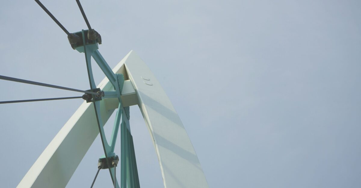 a white and green windmill