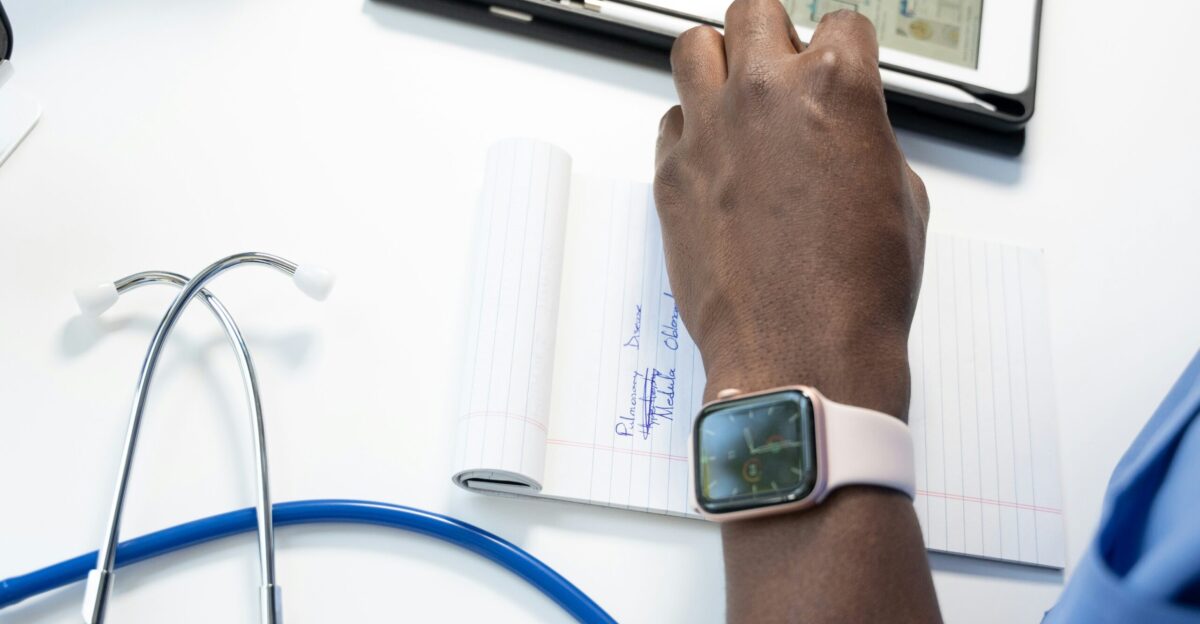 a hand holding a smart watch