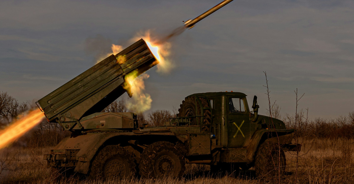 a military vehicle with a missile in the air
