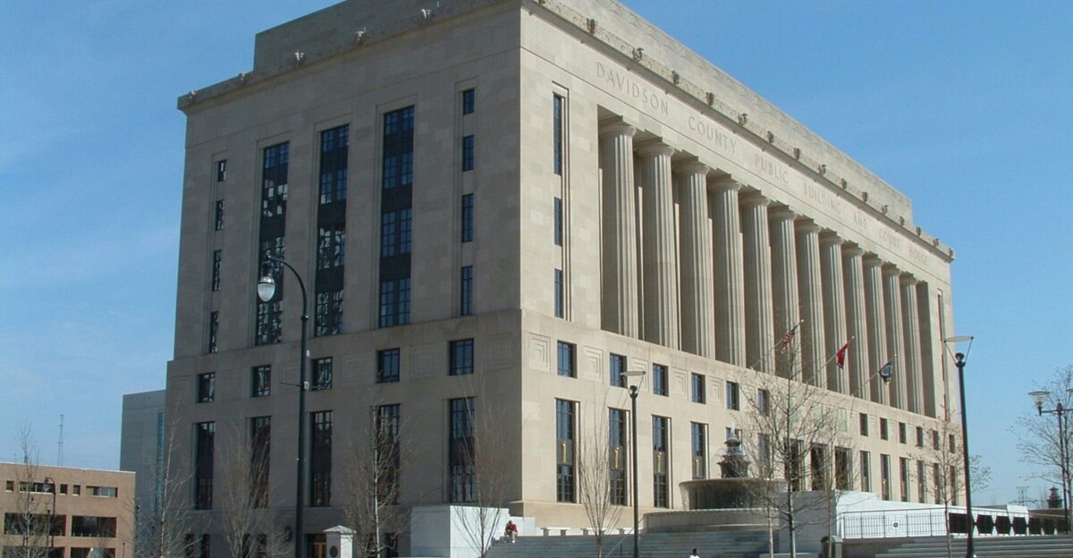 a large building with a clock on the front of it