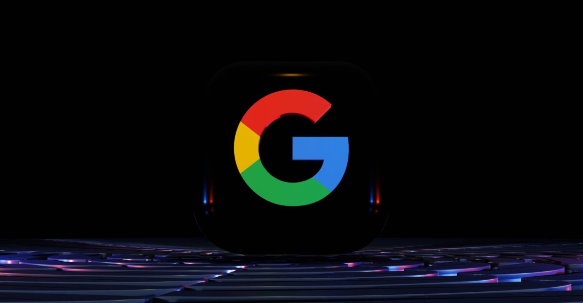 a close up of a computer keyboard with the google logo on it