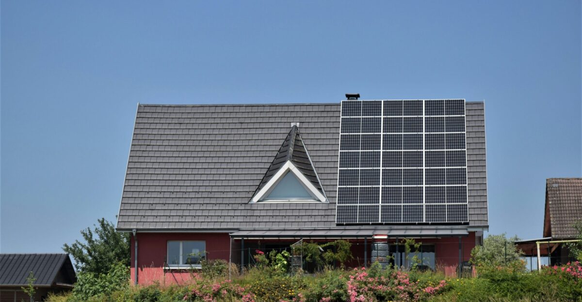 a house with a solar panel on the roof