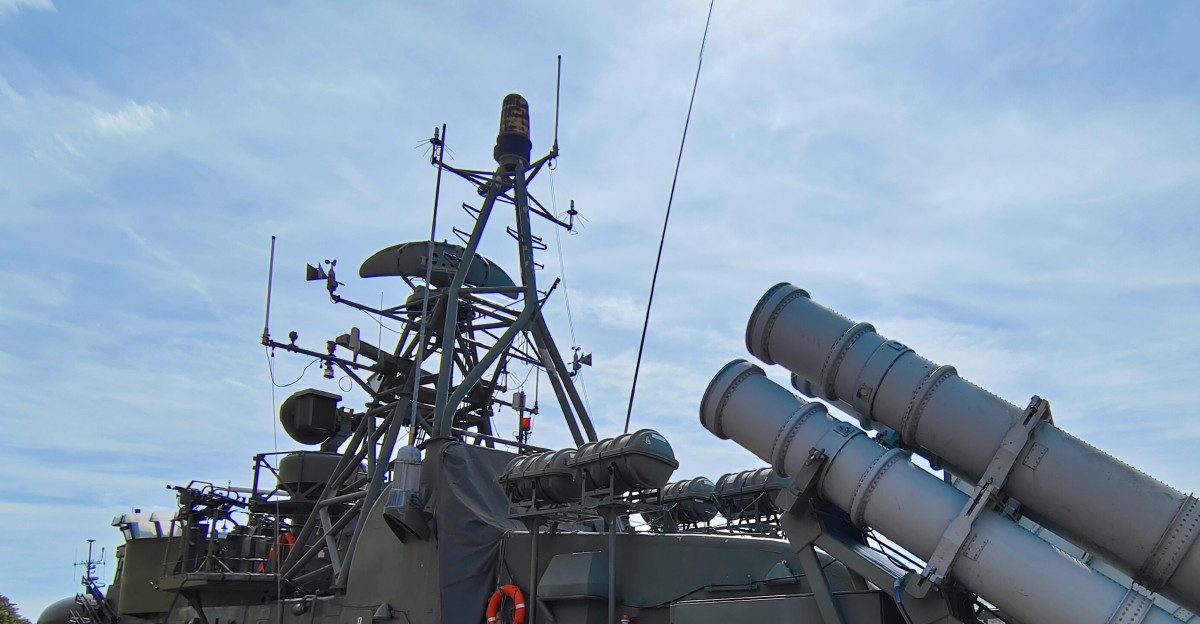 a boat with a large metal object on top of it