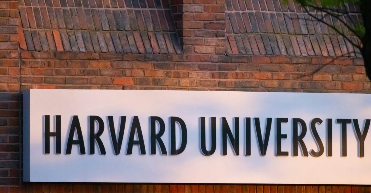 a sign on a brick wall that says harvard university