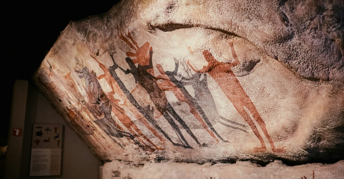 a close up of a rock with paintings on it