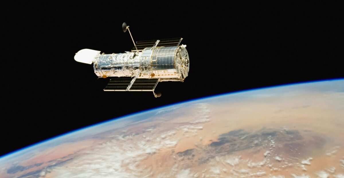 an image of a satellite above the earth