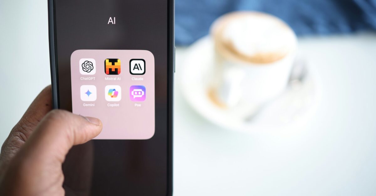 a person holding a cell phone in their hand