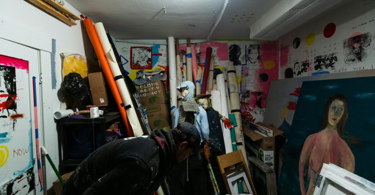 a room filled with lots of art and paintings