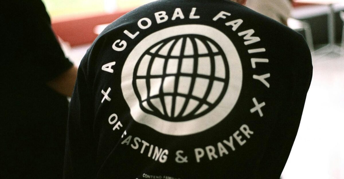 A group of people standing around a building