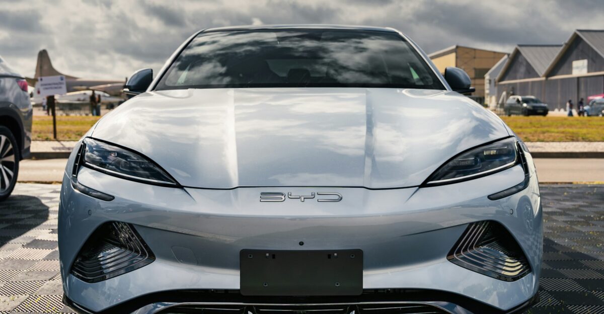 A silver sports car parked in a parking lot