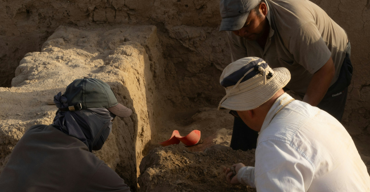 A group of men kneeling down next to each other