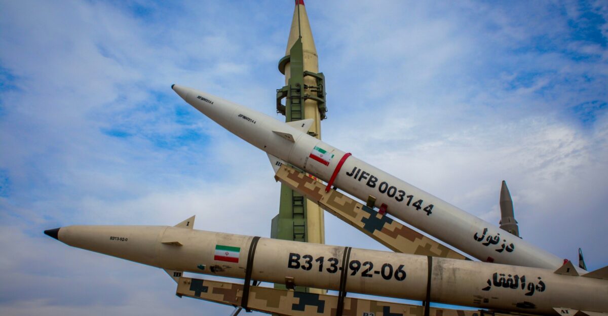 A group of fighter jets sitting on top of each other