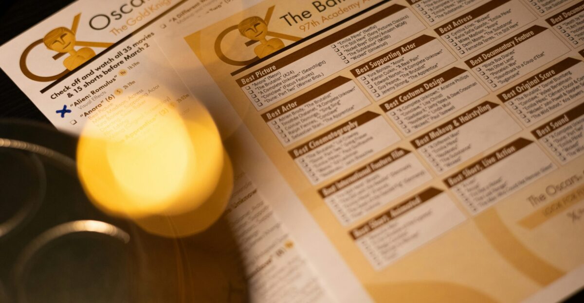 A close up of a menu and a drink on a table
