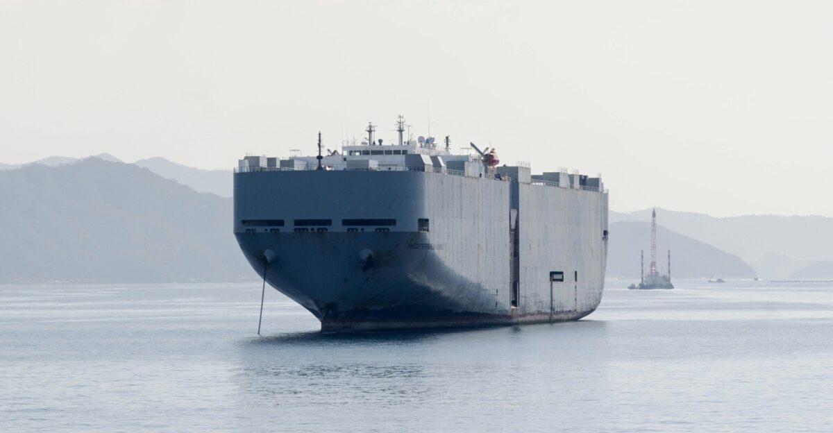 A large boat floating on top of a large body of water