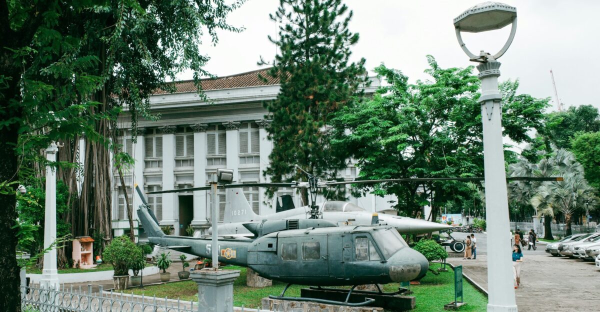 A helicopter rests in front of a historic building