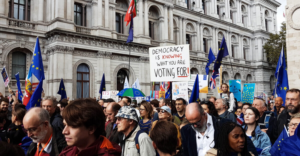 protester at People s Vote London march on 19 October 2019 with Democracy is knowing what you are voting for placard