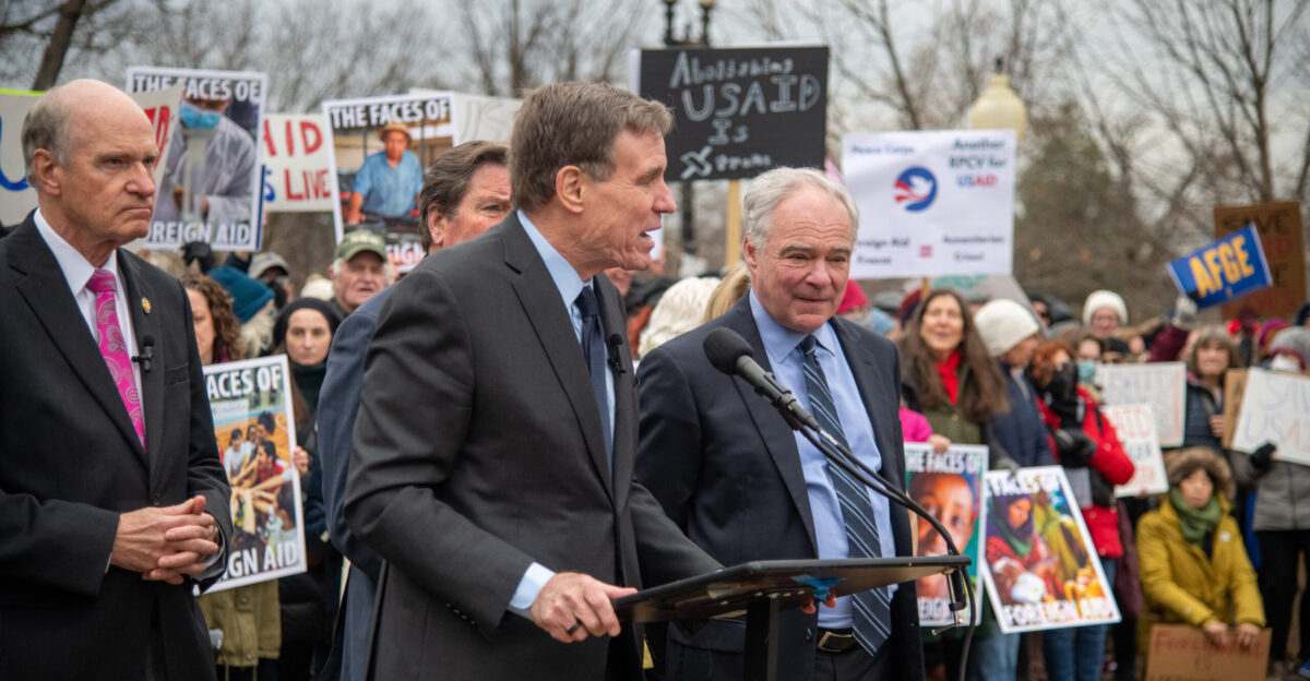 Senator Mark Warner stands with United States Agency for International Development USAID workers on 5 February 2025
