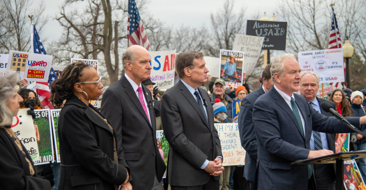 Senator Mark Warner stands with United States Agency for International Development USAID workers on 5 February 2025