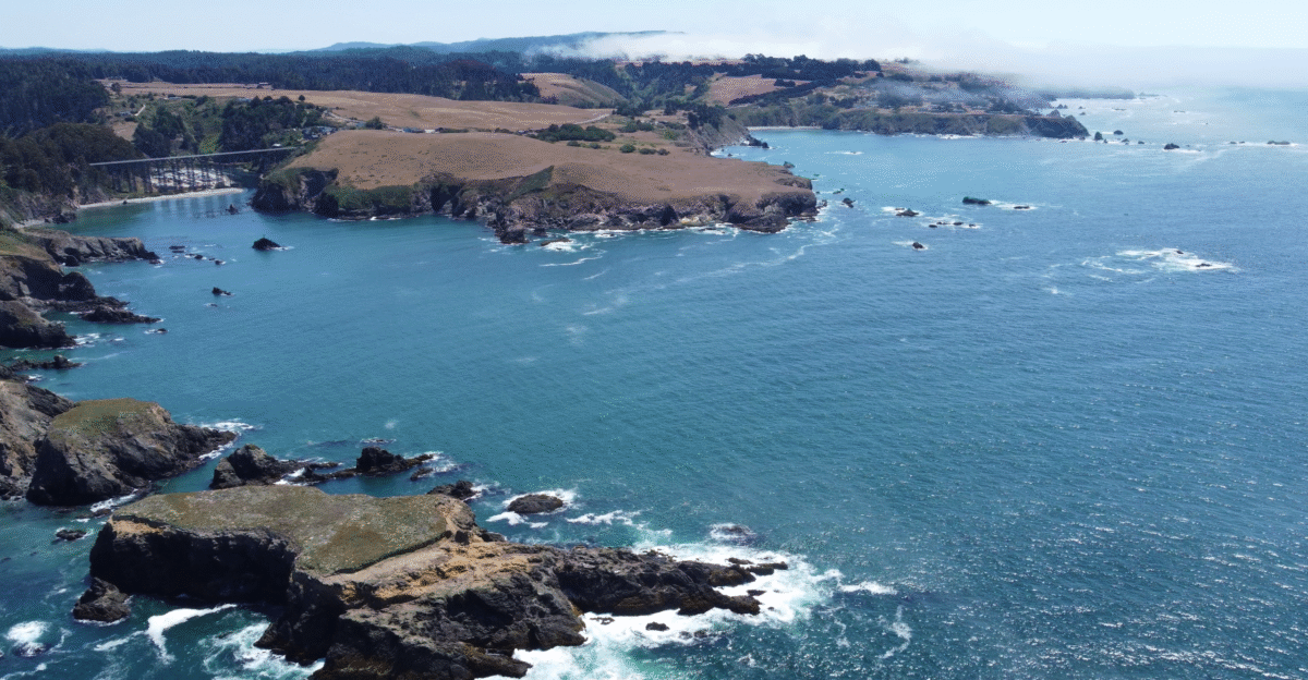 Shot of Albion Head and Albion Bridge from the ocean