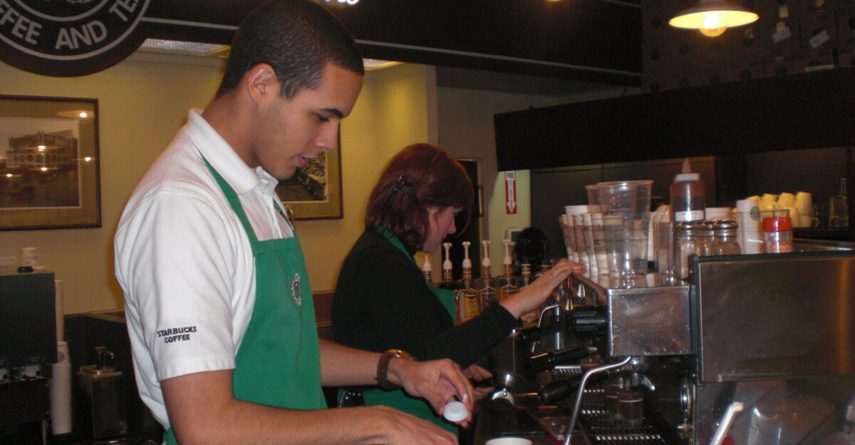 A picture of baristas at work in the first Starbucks coffee shop Seattle WA Picture taken the morning of Saturday January 29 2011
