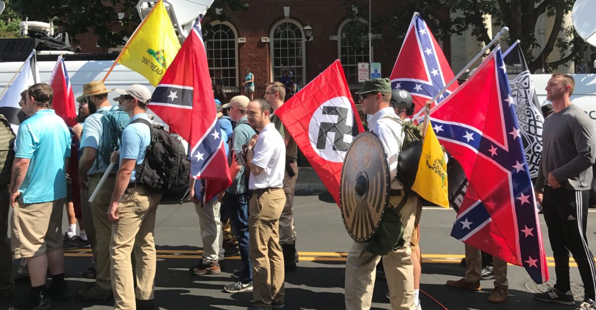 Alt-right members preparing to enter Emancipation Park holding Nazi Confederate and Gadsden flags