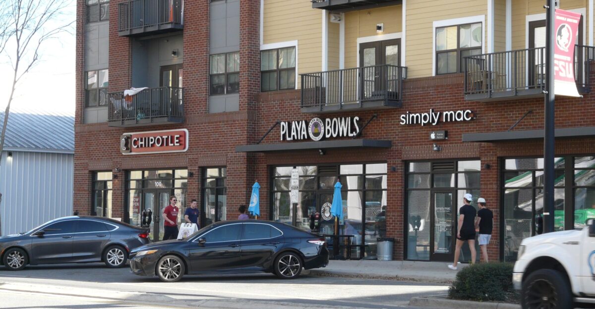 Template Tqq Playa Bowls smoothie bar and closed Simply Mac computer store in a college housing development on Gaines Street in Tallahassee Florida