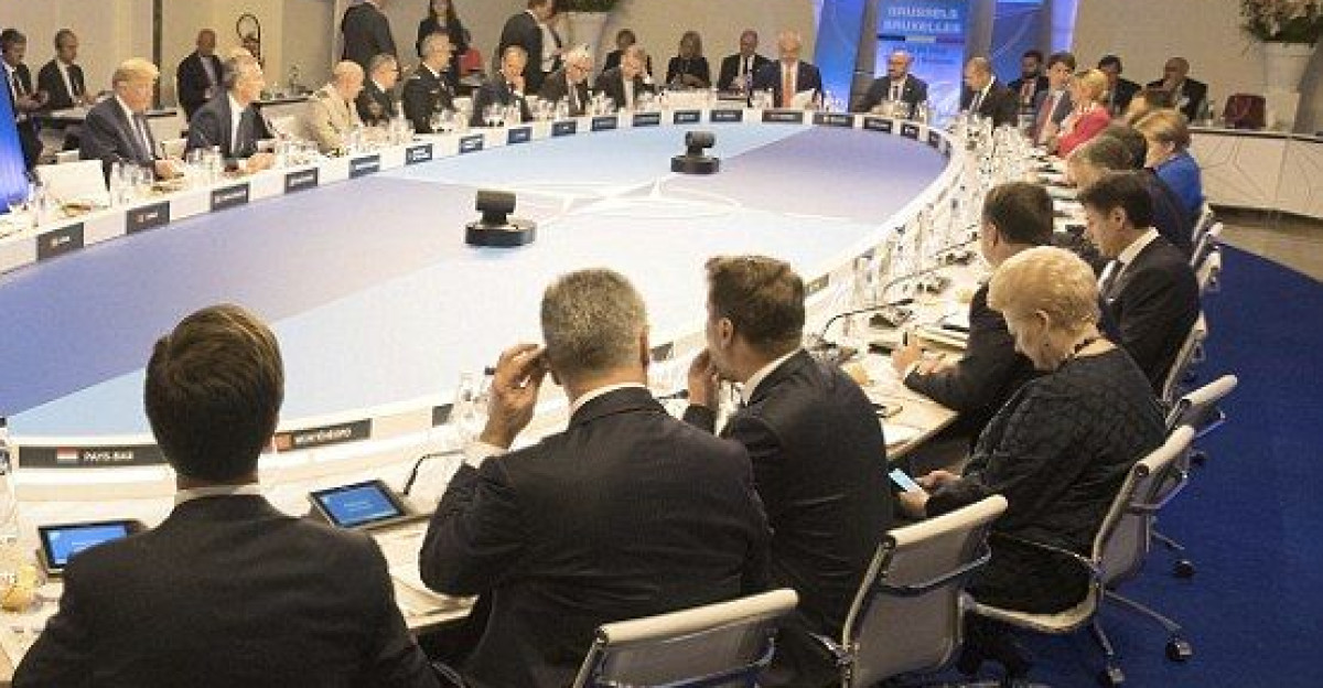 Leaders sit for a dinner of NATO heads of state and government at Park Cinquantenaire in Brussels by Barbie Wiley